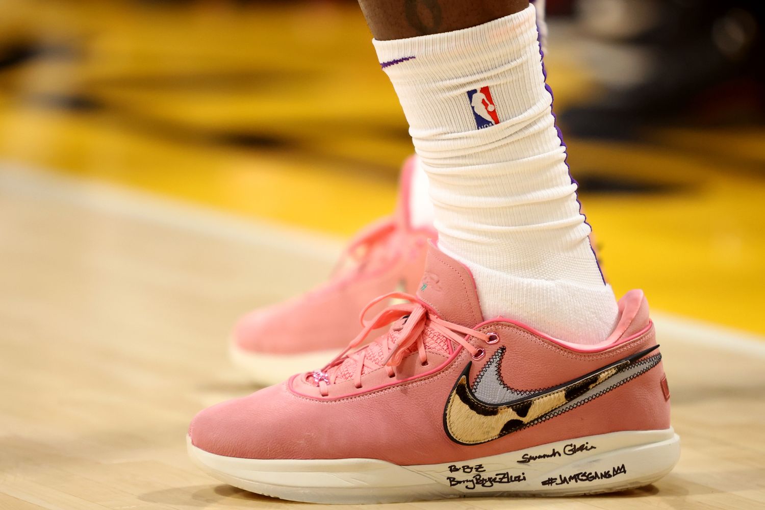 View of pink and white Nike LeBron shoes.